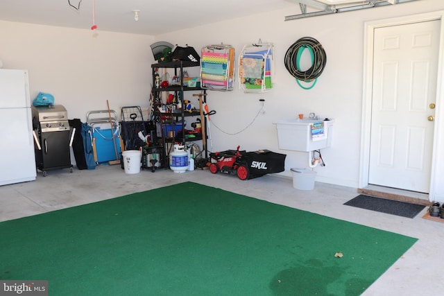 garage with freestanding refrigerator