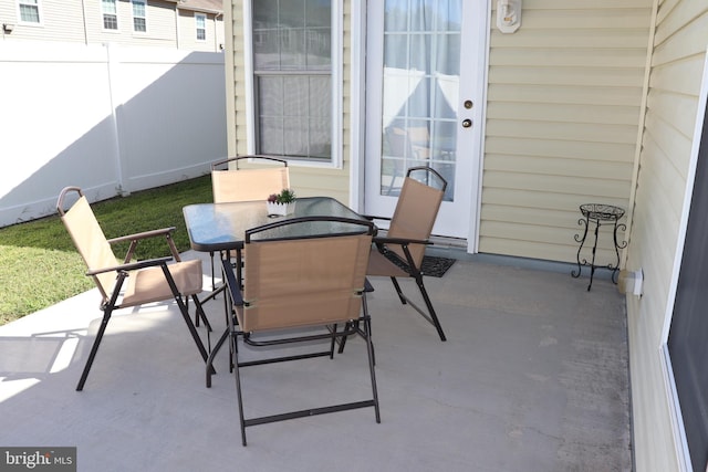 view of patio / terrace featuring outdoor dining space and fence