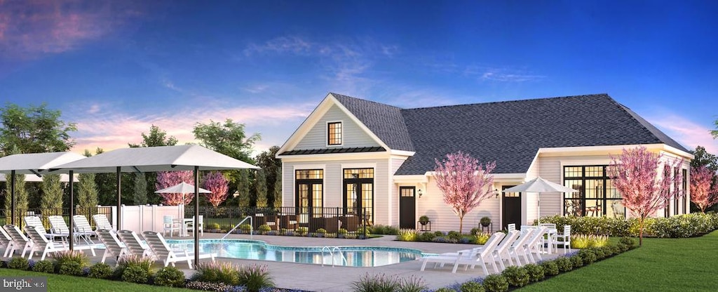 pool with a patio, french doors, and fence