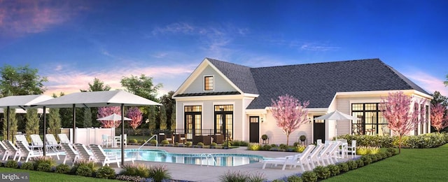 back of house at dusk with a community pool, french doors, a patio, and fence