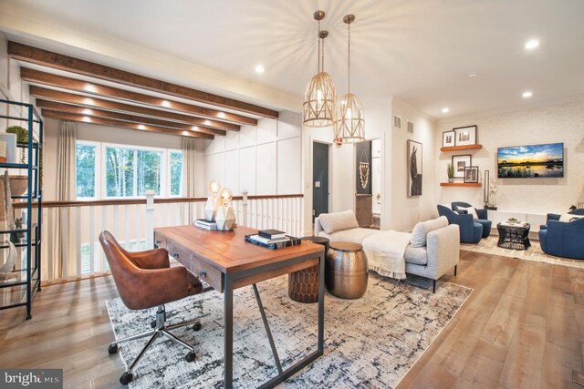 home office featuring light wood-type flooring, an inviting chandelier, and beamed ceiling