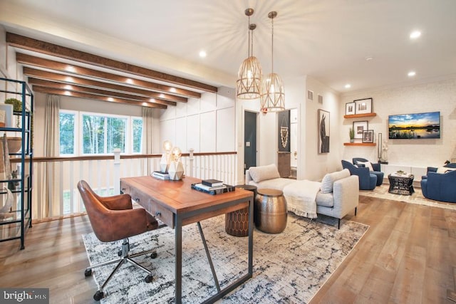 dining room with recessed lighting, beamed ceiling, and wood finished floors