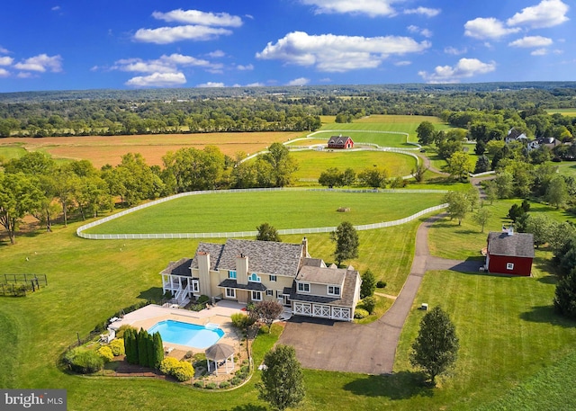 birds eye view of property with a rural view