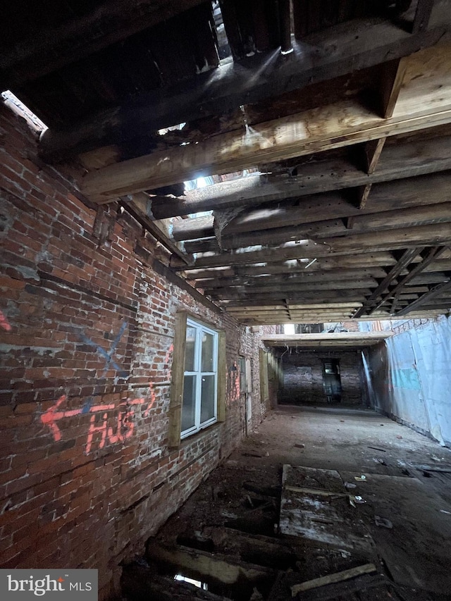 hallway with brick wall