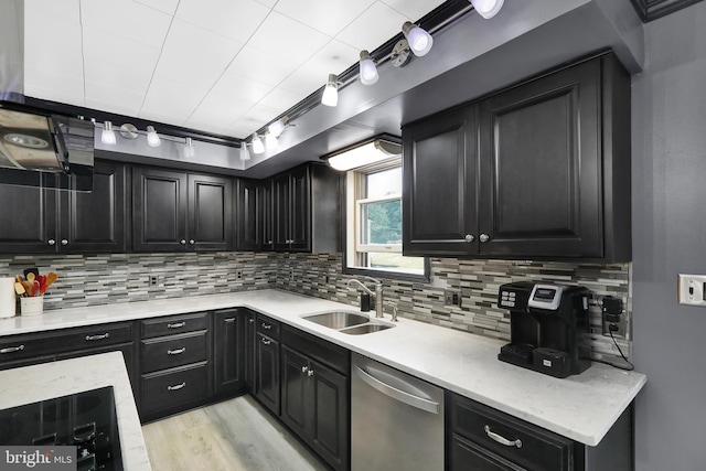 kitchen with black electric stovetop, tasteful backsplash, sink, stainless steel dishwasher, and light hardwood / wood-style floors