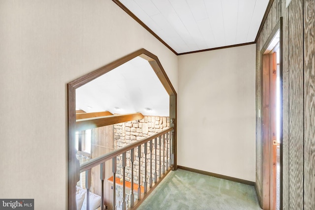 hall featuring lofted ceiling and carpet flooring