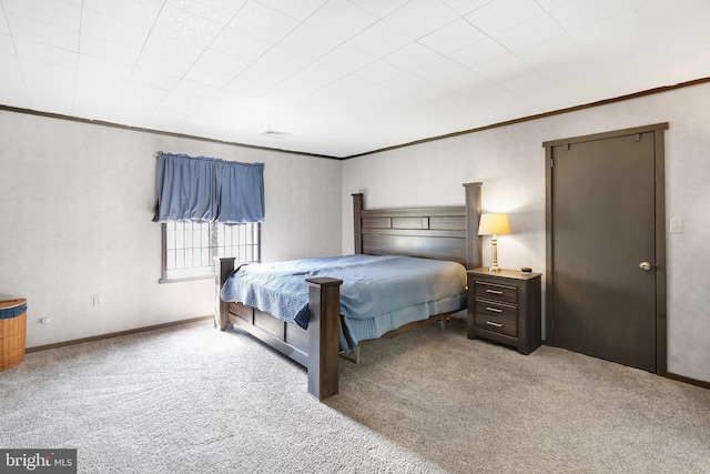 carpeted bedroom with crown molding