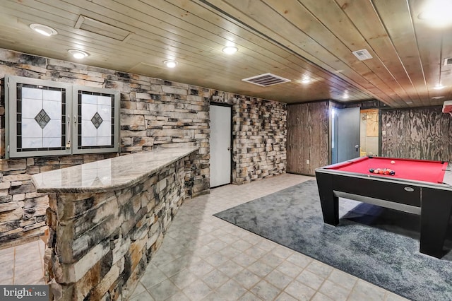 recreation room featuring bar area, pool table, and wooden ceiling