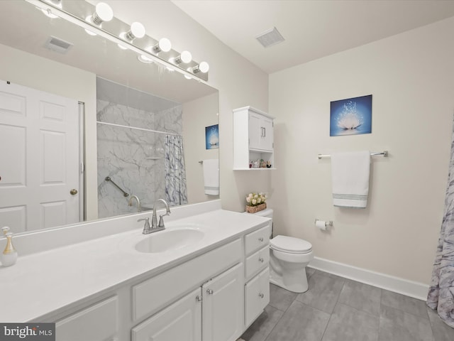 bathroom with a shower with curtain, tile patterned floors, vanity, and toilet