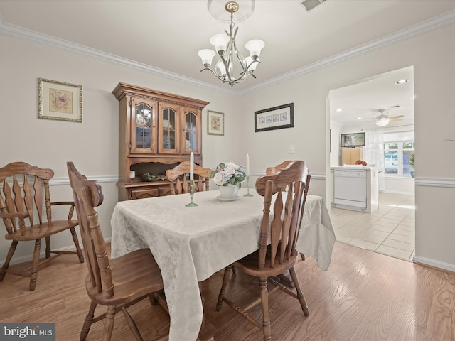 dining room featuring ceiling fan with notable chandelier, light hardwood / wood-style flooring, and ornamental molding