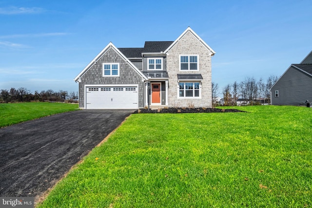 879 Ashfield Dr, Carlisle, PA 17015 - view of front facade with asphalt driveway, stone siding, a garage, and a front yard