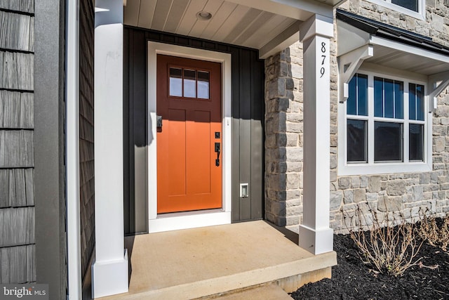 view of exterior entry with stone siding