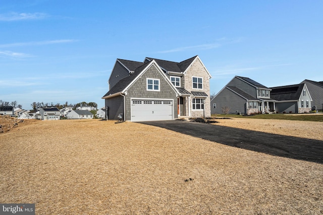 view of front facade featuring a garage and driveway