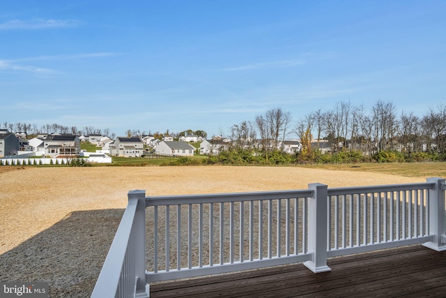 wooden terrace with a residential view