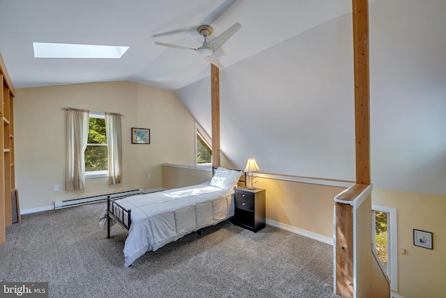 carpeted bedroom with ceiling fan, a baseboard radiator, and lofted ceiling with skylight