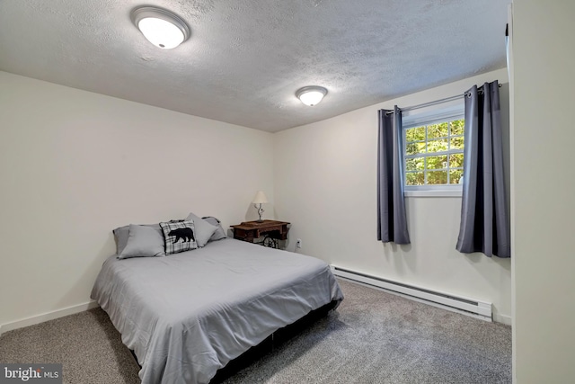 carpeted bedroom with a baseboard radiator and a textured ceiling