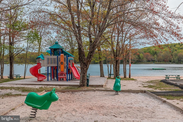 view of play area with a water view