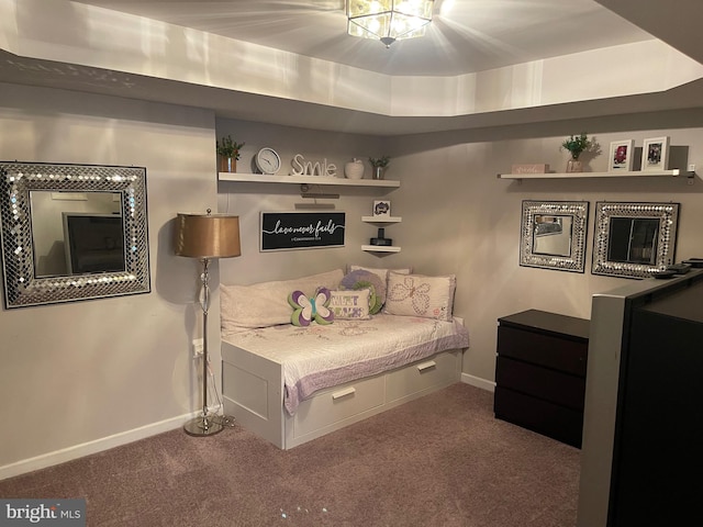 bedroom featuring carpet flooring and baseboards