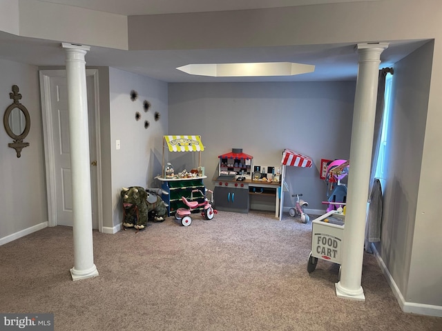 playroom featuring baseboards, ornate columns, and carpet floors