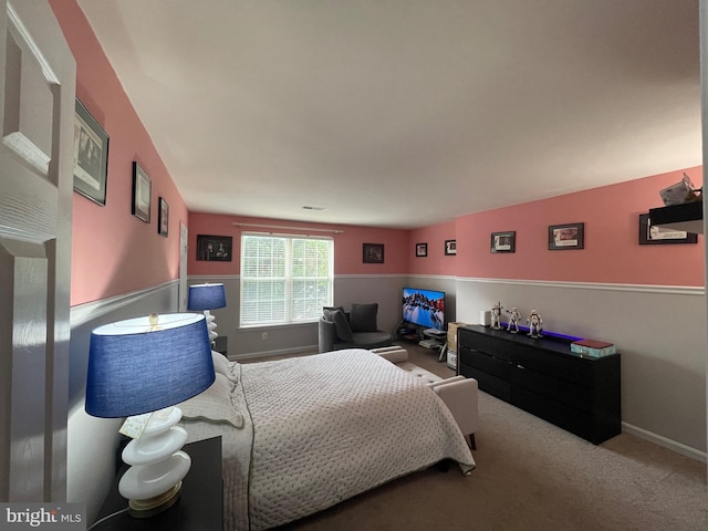 carpeted bedroom featuring visible vents