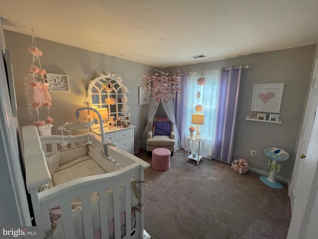 carpeted bedroom featuring baseboards and visible vents