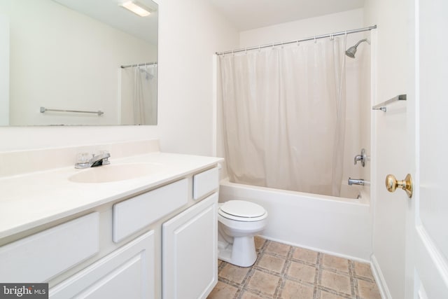 full bathroom featuring vanity, toilet, and shower / tub combo with curtain