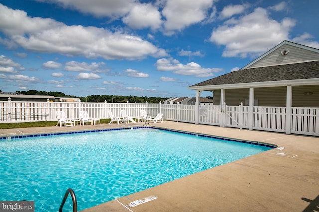 view of swimming pool with a patio