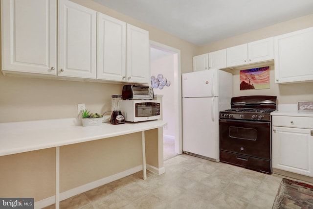 kitchen featuring white cabinets and white appliances