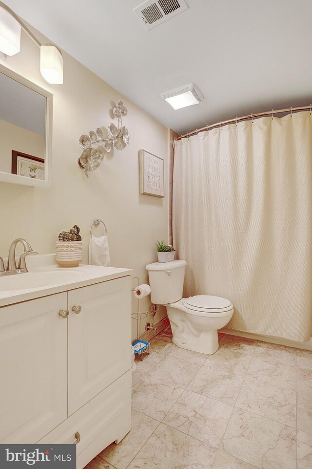 bathroom with vanity and toilet