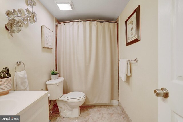 bathroom with a shower with shower curtain, vanity, toilet, and tile patterned flooring