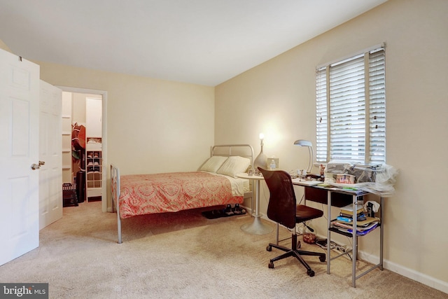 bedroom with light colored carpet