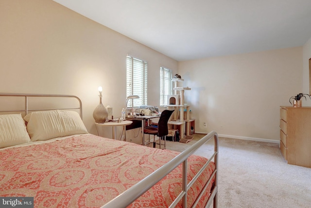 bedroom featuring light carpet