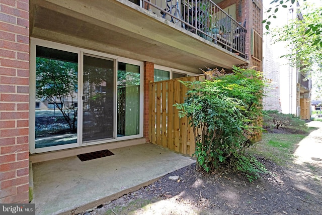 entrance to property with a balcony