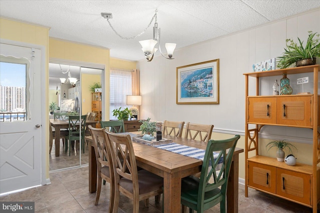 dining room featuring a notable chandelier and tile patterned floors