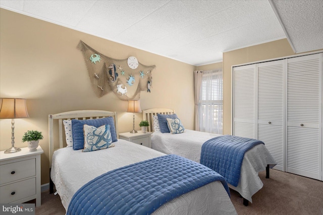 carpeted bedroom with crown molding and a closet