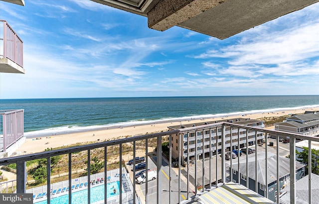 balcony with a view of the beach and a water view