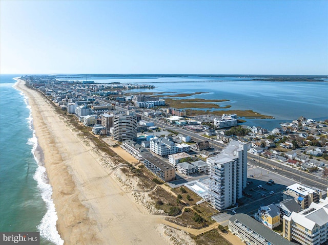 birds eye view of property featuring a view of the beach and a water view