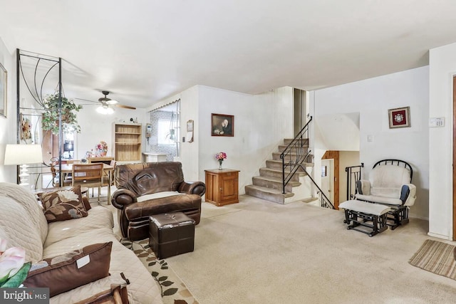 living room featuring light colored carpet and ceiling fan