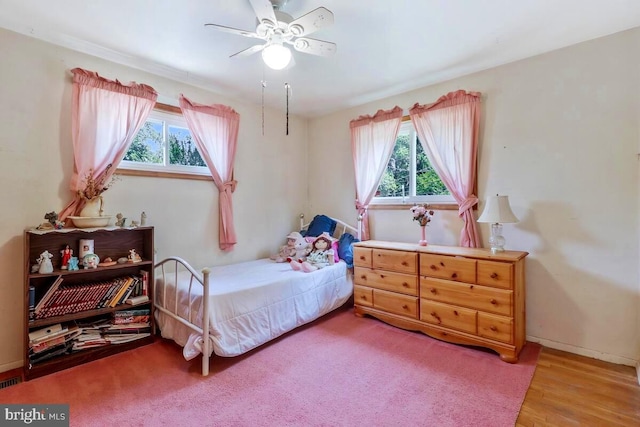 bedroom featuring ceiling fan and wood-type flooring