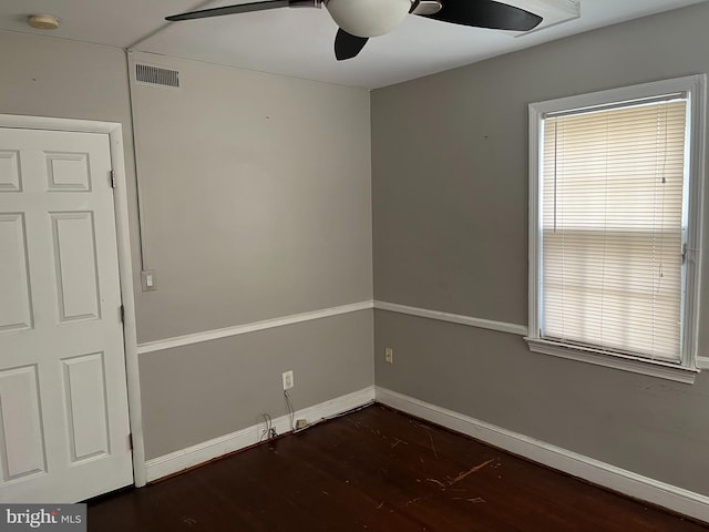 empty room featuring dark wood-type flooring