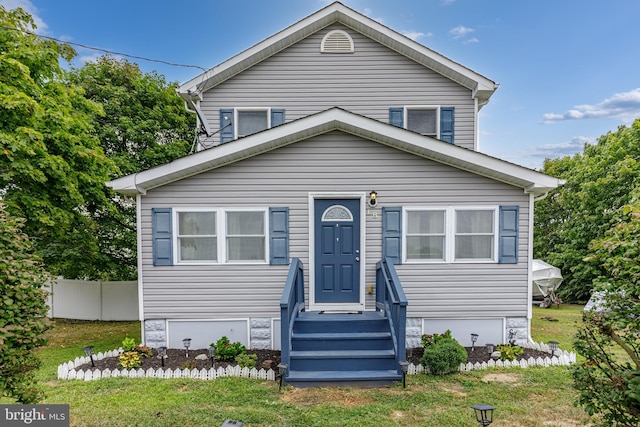 bungalow-style house with a front yard