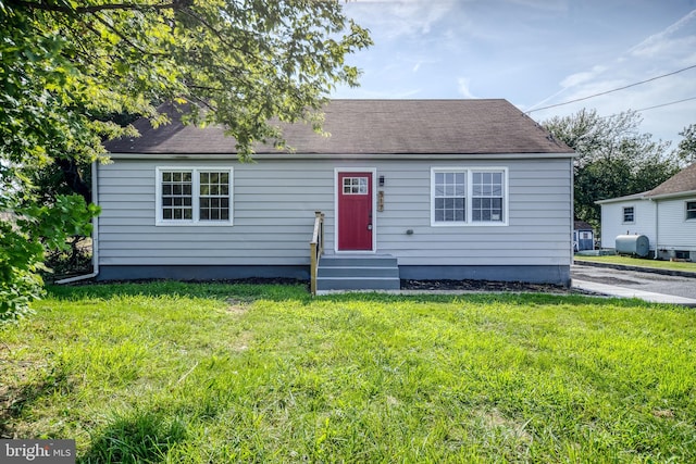 bungalow-style house with a front yard