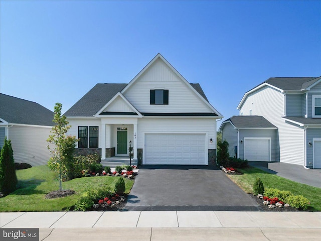 view of front facade with a garage and a front yard