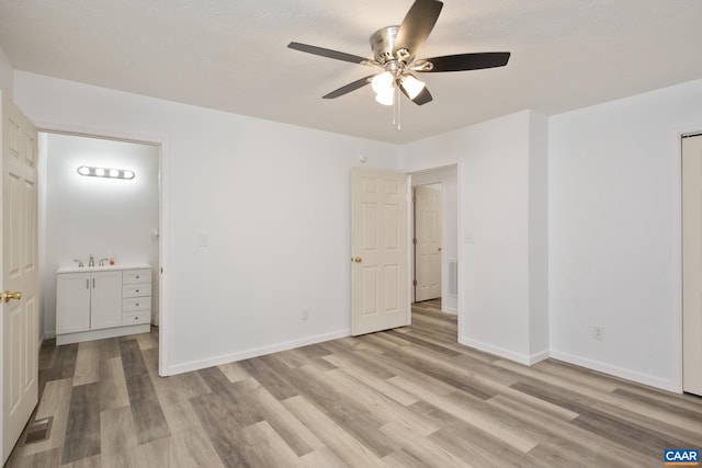 spare room with ceiling fan and light hardwood / wood-style floors