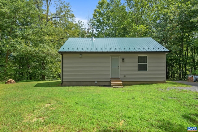 view of outbuilding featuring a yard