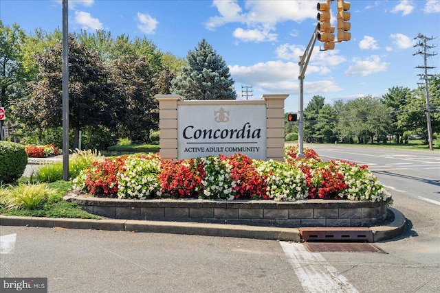 community sign with uncovered parking