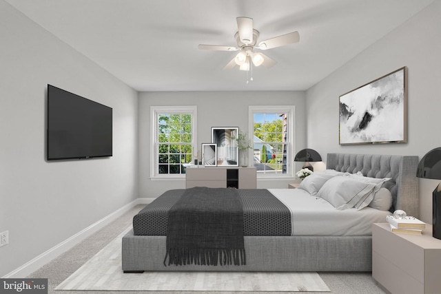 bedroom with a ceiling fan, light colored carpet, and baseboards