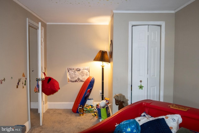 carpeted bedroom with crown molding and a closet