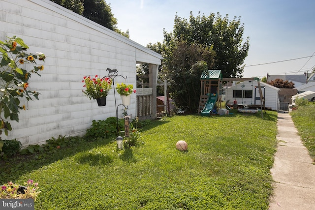 view of yard with a playground