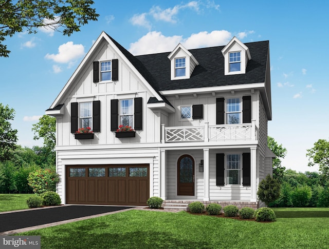 view of front facade with a balcony, a garage, and a front lawn